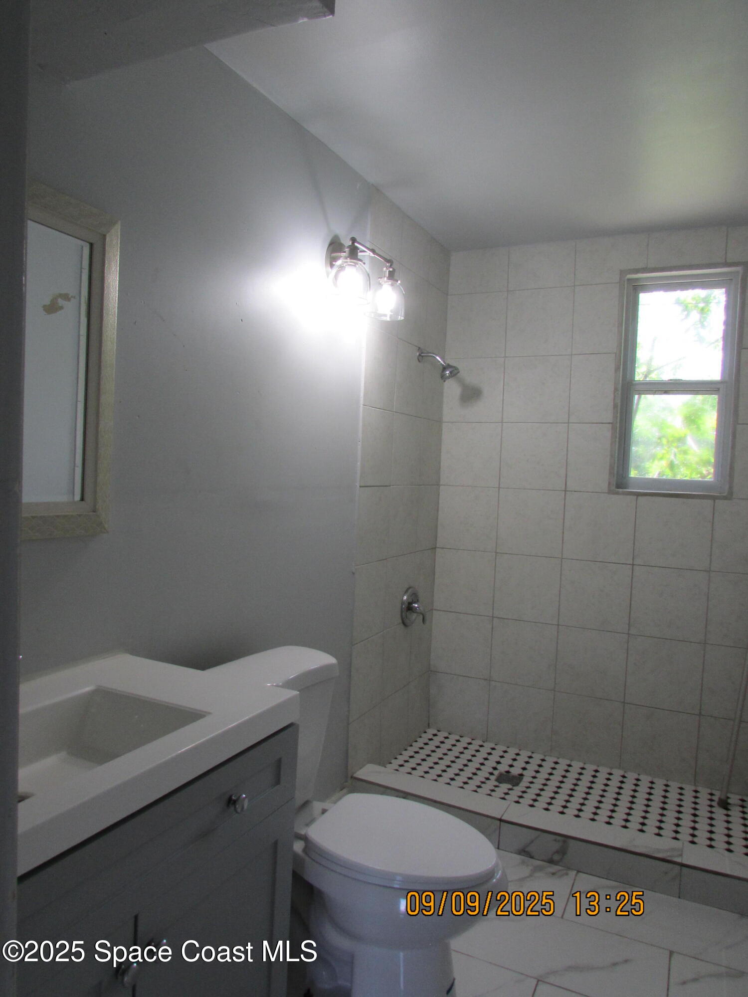 1647 Dixie Way Melbourne, FL 32935 - Photo 11 of 15 a bathroom with a toilet and a sink