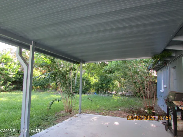 a view of a yard with an outdoor space