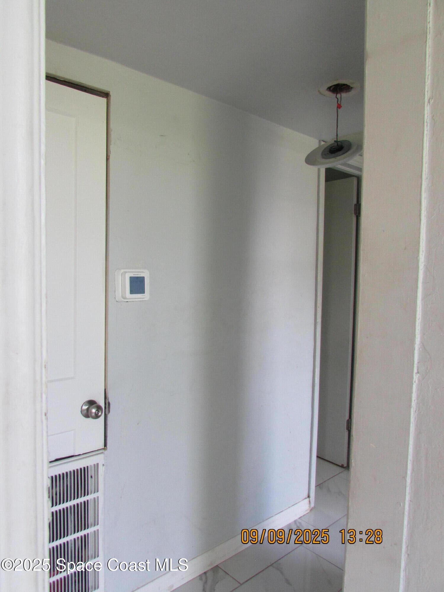 1647 Dixie Way Melbourne, FL 32935 - Photo 9 of 15 a view of a hallway with wooden floor and closet