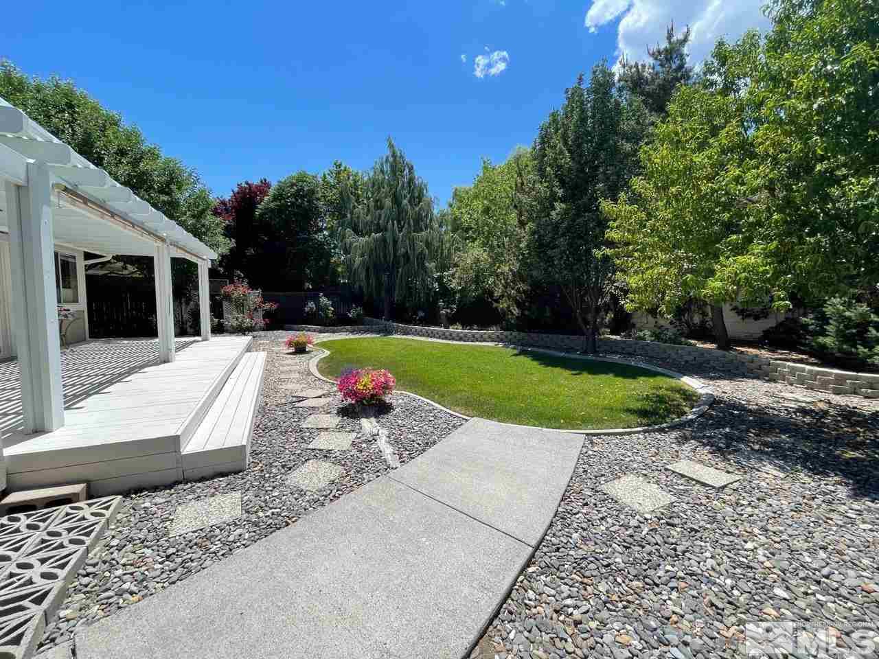7689 Barnsdale Road Reno, NV 89511 - Photo 8 of 18 a view of a backyard with a garden and entertaining space