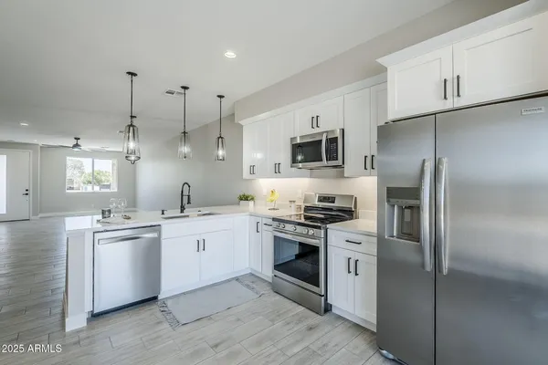 a kitchen with a stove and a sink