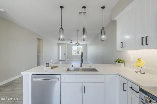 a bathroom with a sink and shower