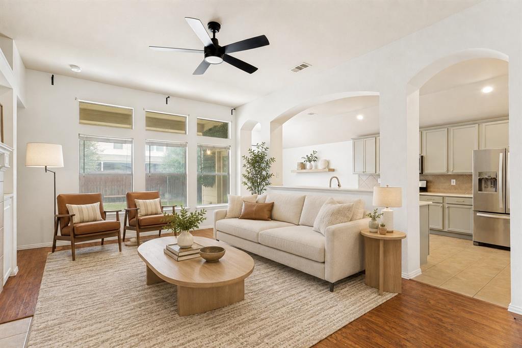 1316 Mountain Air Trail Fort Worth, TX 76131 - Photo 1 of 23 Wood-finish flooring, a ceiling fan, recessed lighting, and expansive windows