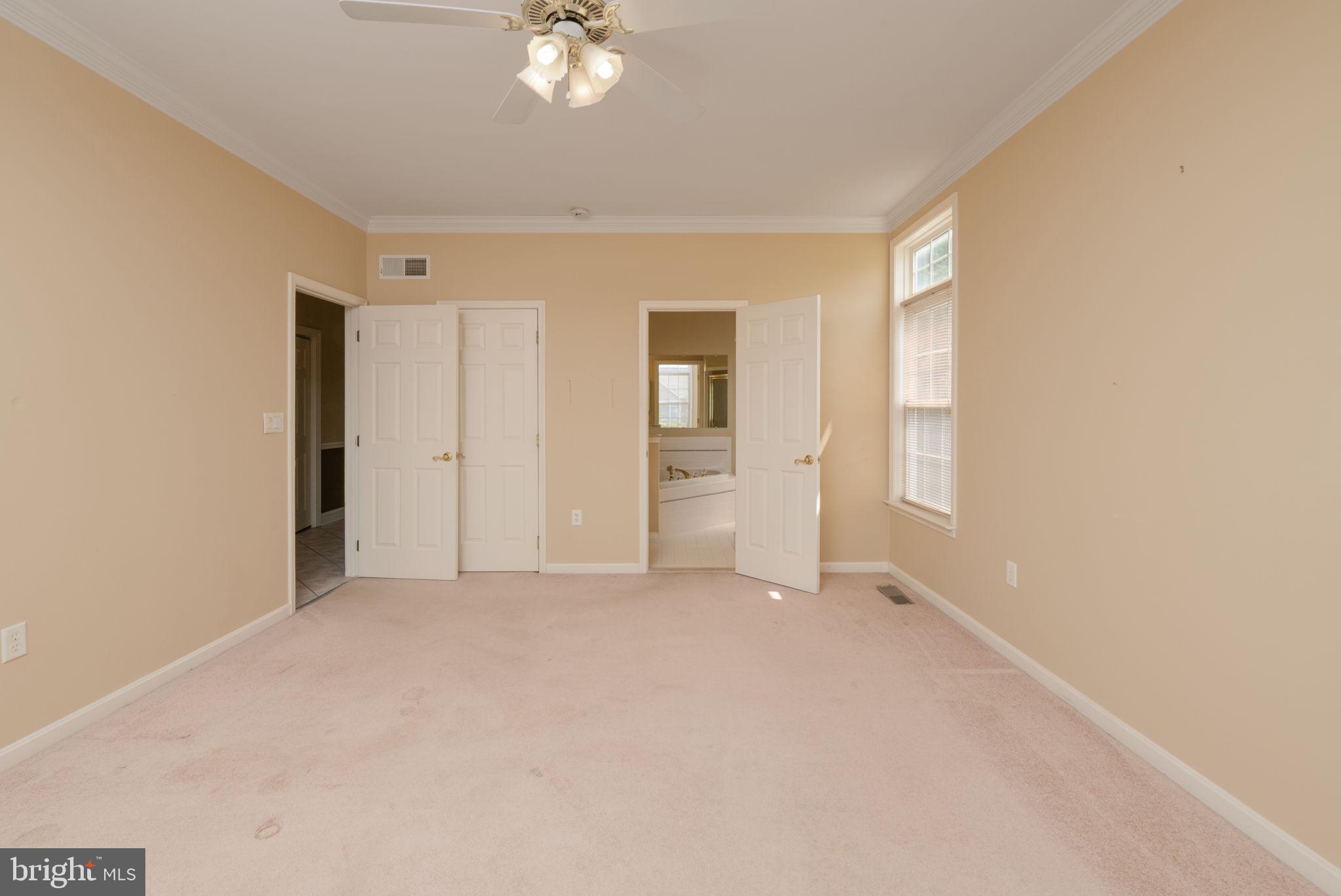 16841 Devon Road Lewes, DE 19958 - Photo 11 of 43 an empty room with windows and closet