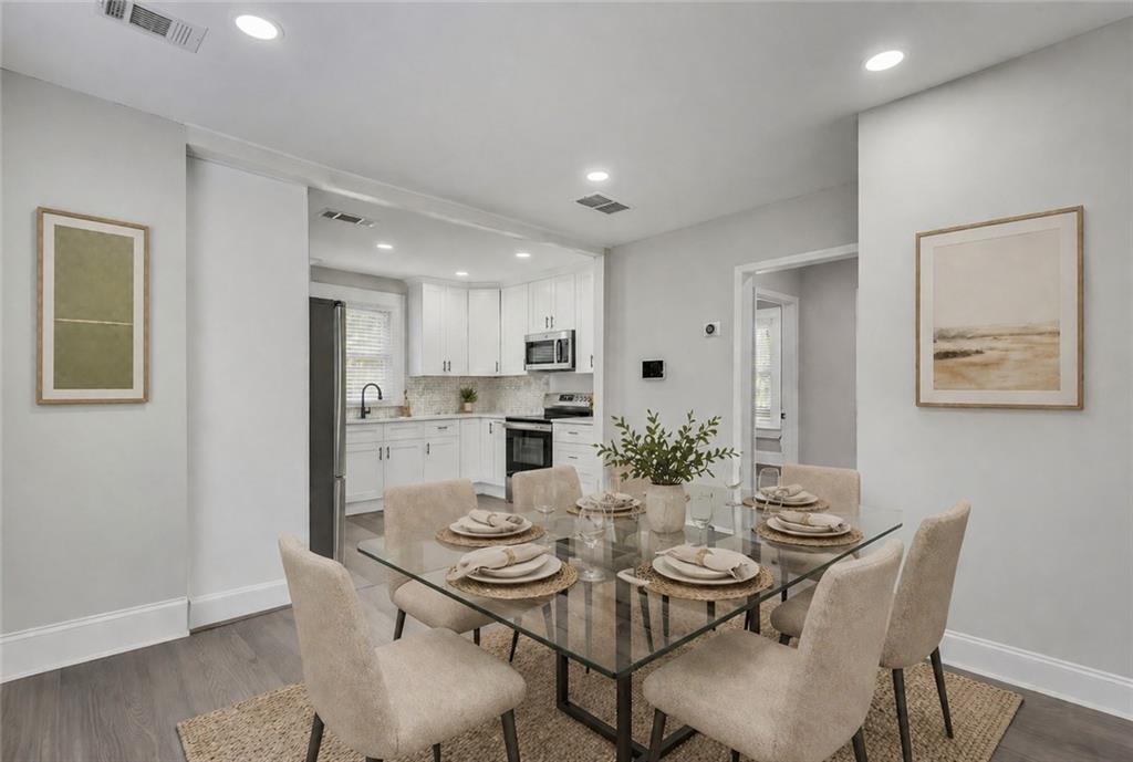 2300 Dauphine Street Atlanta, GA 30344 - Photo 12 of 34 a view of a dining room with furniture and wooden floor