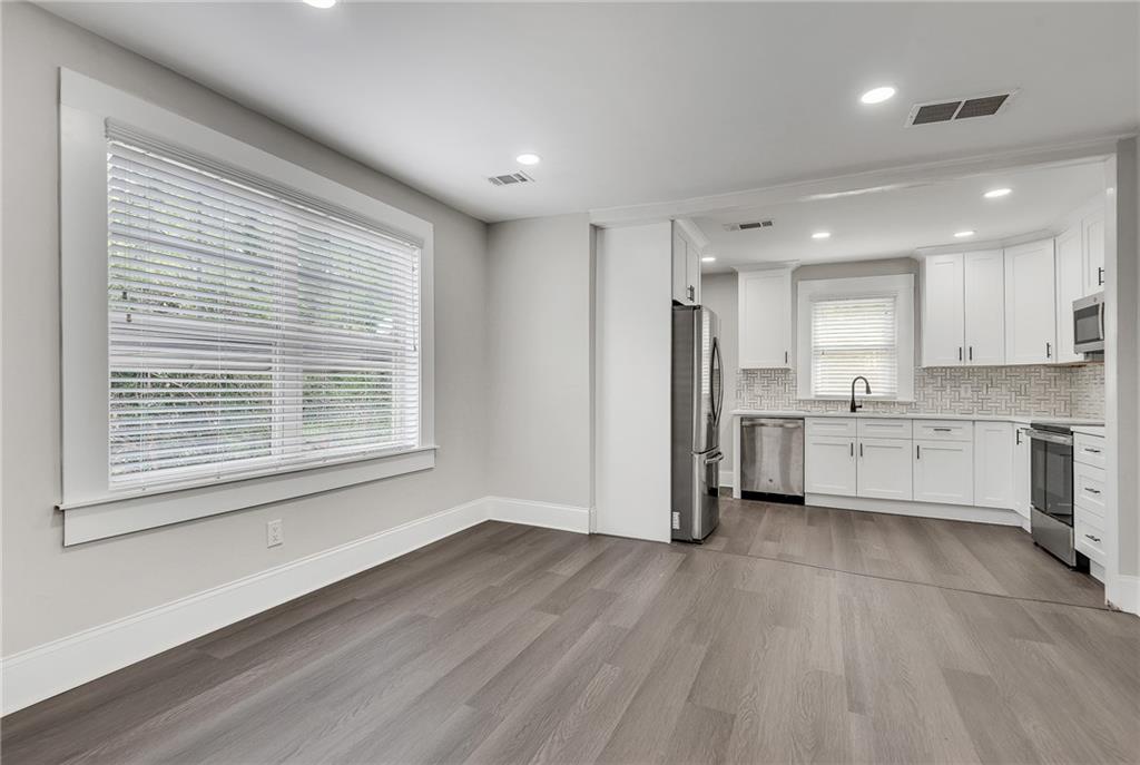 2300 Dauphine Street Atlanta, GA 30344 - Photo 14 of 34 a view of a kitchen with wooden floor and electronic appliances