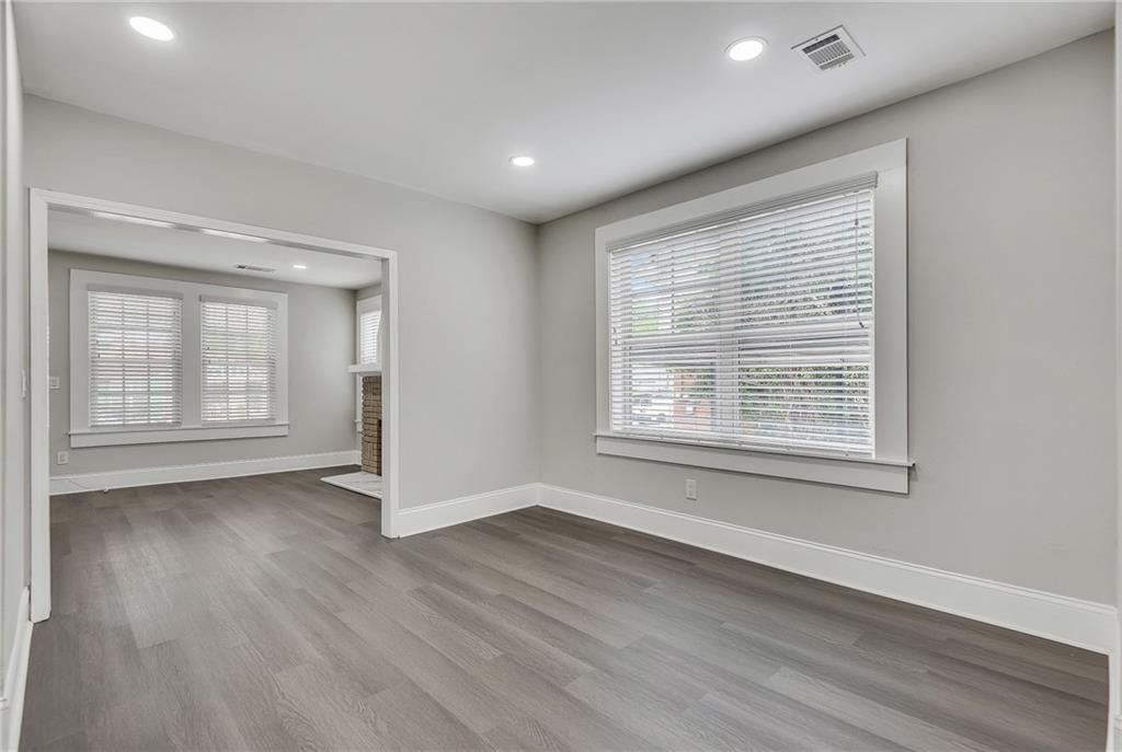 2300 Dauphine Street Atlanta, GA 30344 - Photo 15 of 34 a view of an empty room with wooden floor and a window