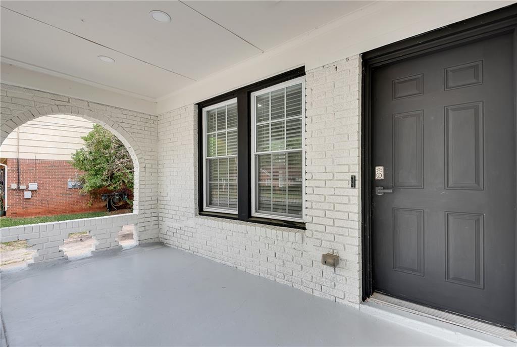 2300 Dauphine Street Atlanta, GA 30344 - Photo 2 of 34 front view of a brick house with a large window