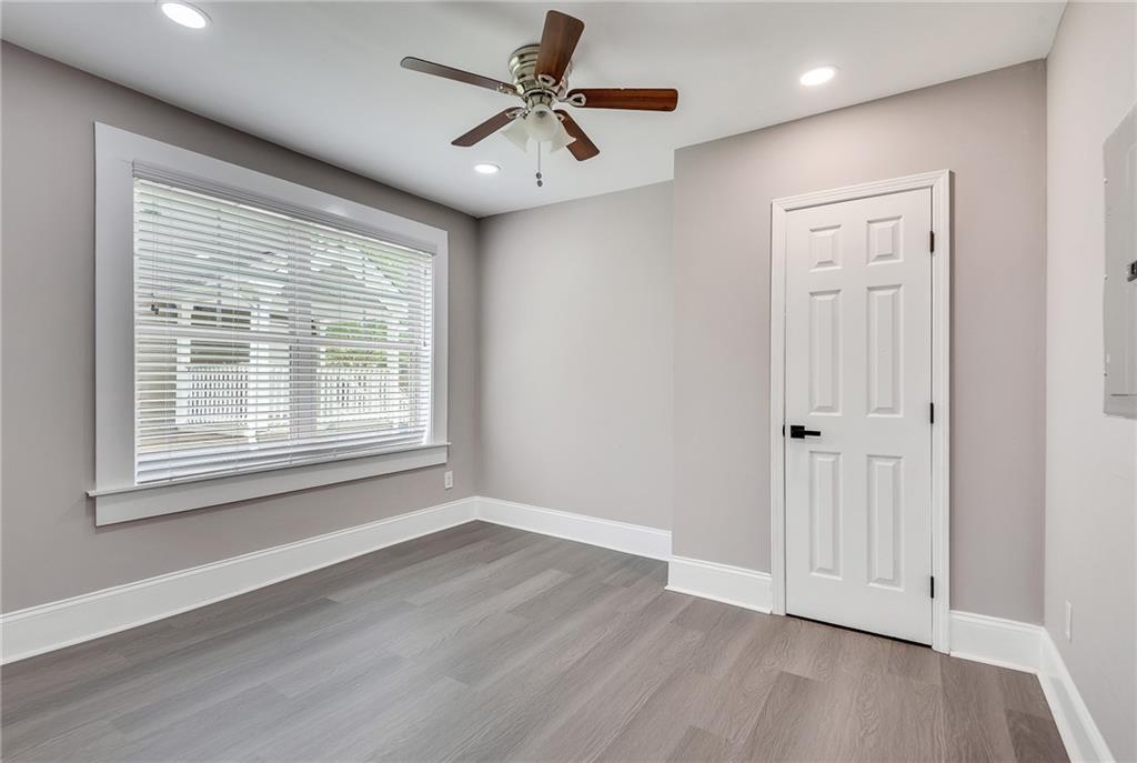 2300 Dauphine Street Atlanta, GA 30344 - Photo 26 of 34 a view of an empty room with a window and wooden floor