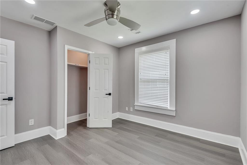 2300 Dauphine Street Atlanta, GA 30344 - Photo 28 of 34 a view of an empty room with wooden floor and a window