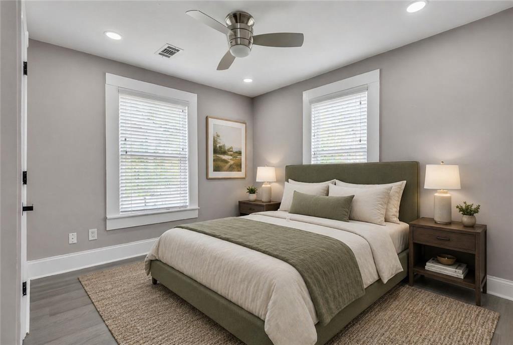 2300 Dauphine Street Atlanta, GA 30344 - Photo 29 of 34 a bedroom with a large bed and a chandelier