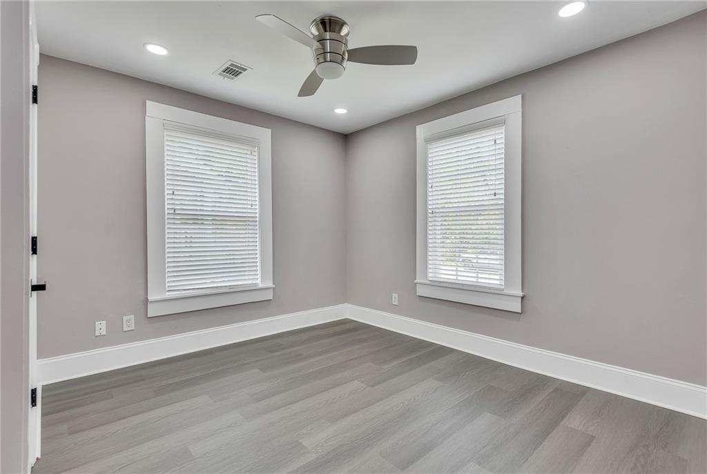 2300 Dauphine Street Atlanta, GA 30344 - Photo 30 of 34 a view of an empty room with a window and wooden floor