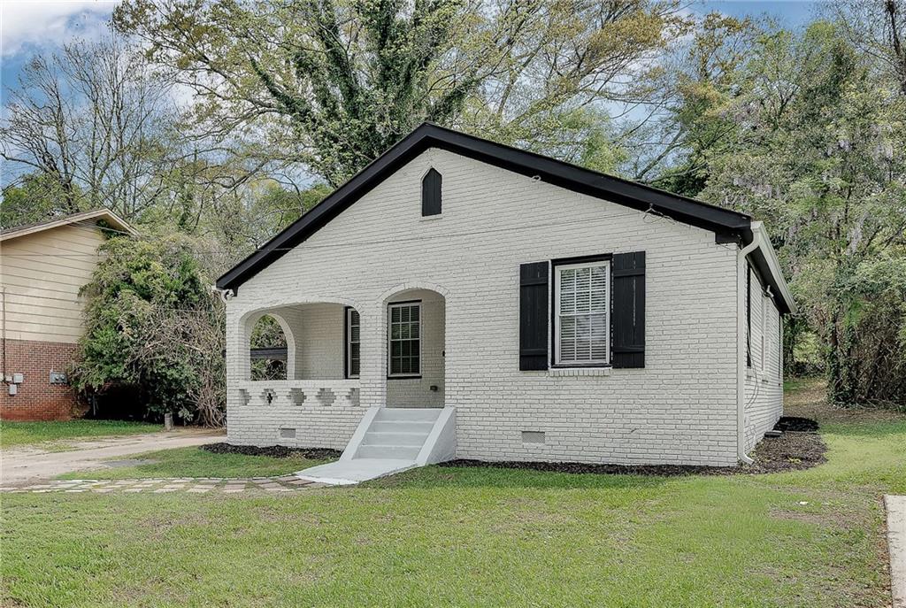 2300 Dauphine Street Atlanta, GA 30344 - Photo 3 of 34 front view of a house with a yard