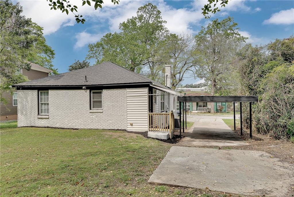 2300 Dauphine Street Atlanta, GA 30344 - Photo 31 of 34 a front view of a house with a yard and garage