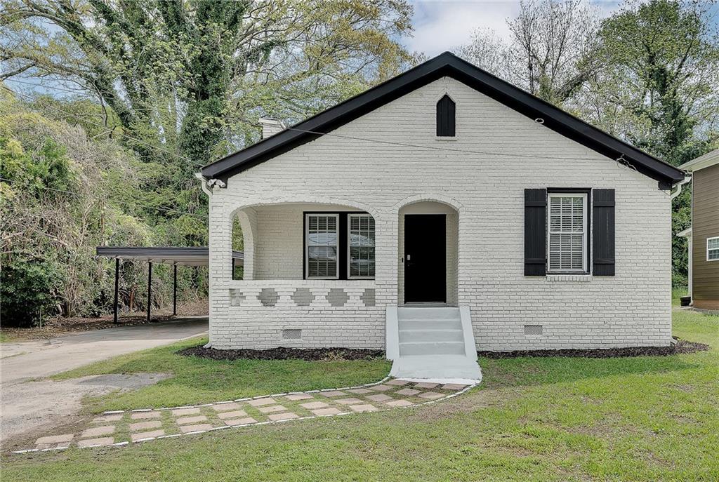 2300 Dauphine Street Atlanta, GA 30344 - Photo 4 of 34 a view of a house with a yard