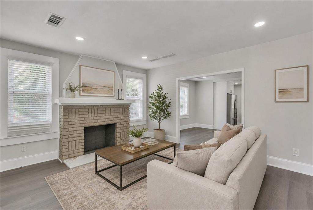 2300 Dauphine Street Atlanta, GA 30344 - Photo 8 of 34 a living room with furniture and a fireplace