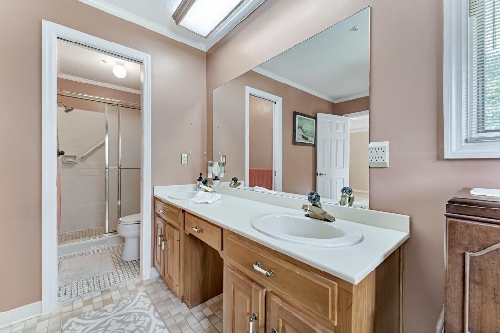 4640 Spot Road Cumming, GA 30040 - Photo 18 of 28 a bathroom with a sink double vanity and a mirror