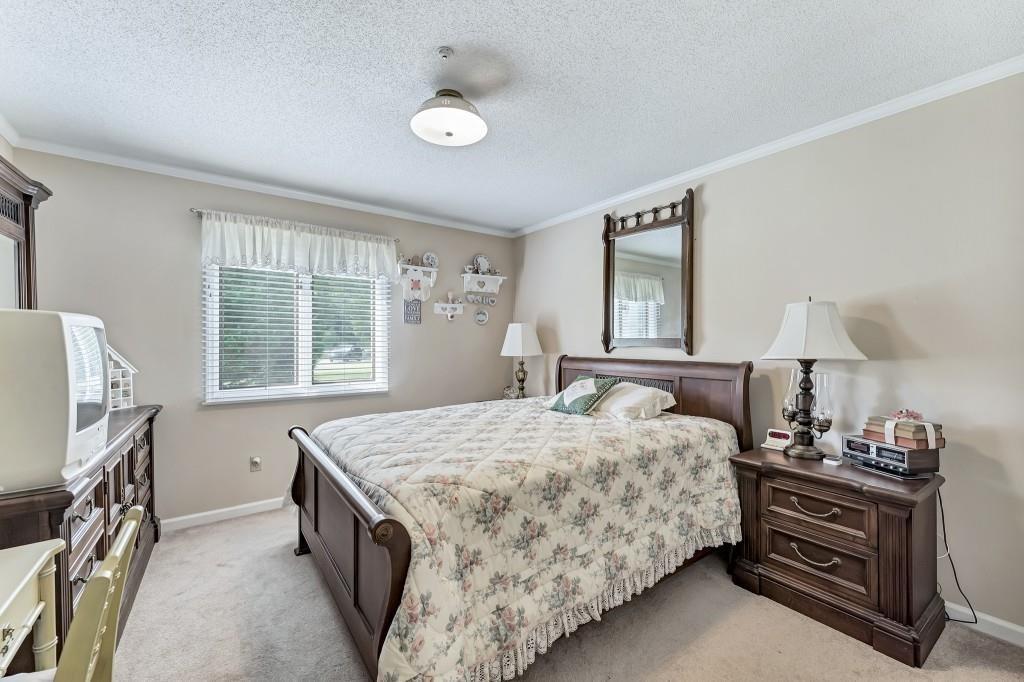 4640 Spot Road Cumming, GA 30040 - Photo 20 of 28 a bedroom with a bed and a window