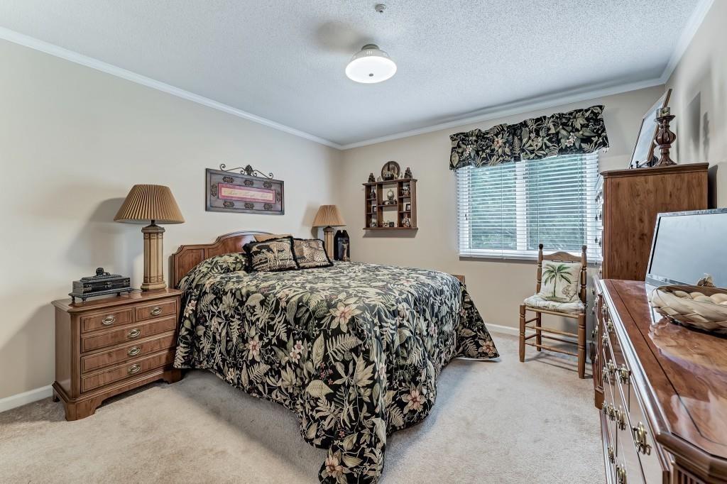 4640 Spot Road Cumming, GA 30040 - Photo 22 of 28 a bedroom with a bed window and dresser
