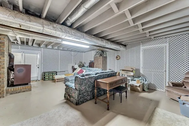 a roof deck with table and chairs