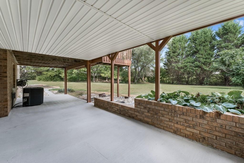 4640 Spot Road Cumming, GA 30040 - Photo 24 of 28 a view of a room with porch and outdoor space