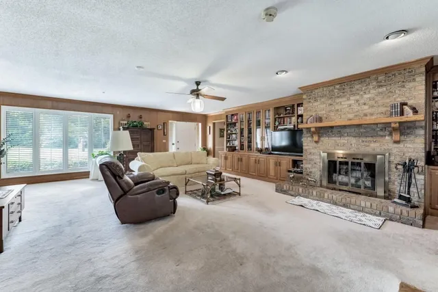 a living room with furniture and a fireplace