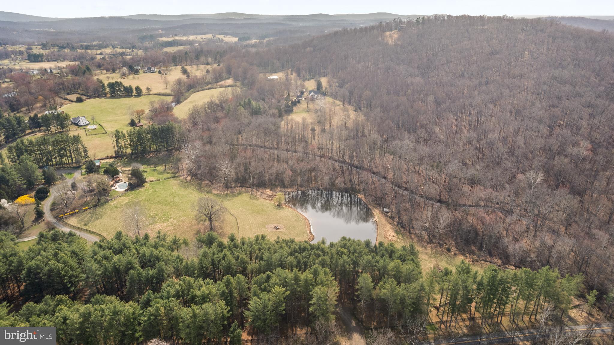 10803 Crest Hill Road Marshall, VA 20115 - Photo 29 of 30 Serene landscape with pond and hills.