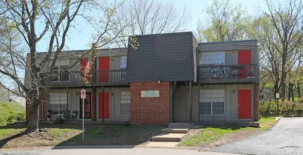 a view of a brick building with many windows