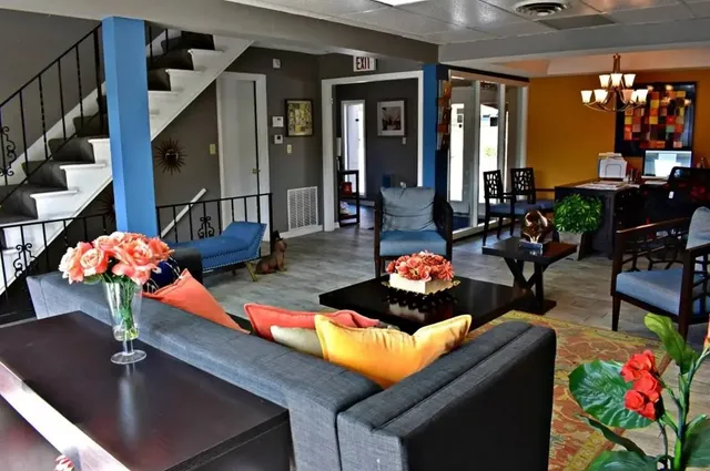 a living room filled with furniture and flowers