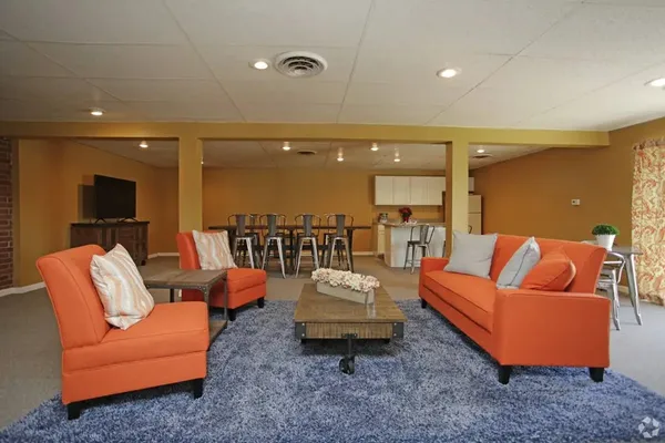 a living room with furniture and a flat screen tv