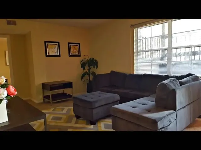 a living room with furniture and a window