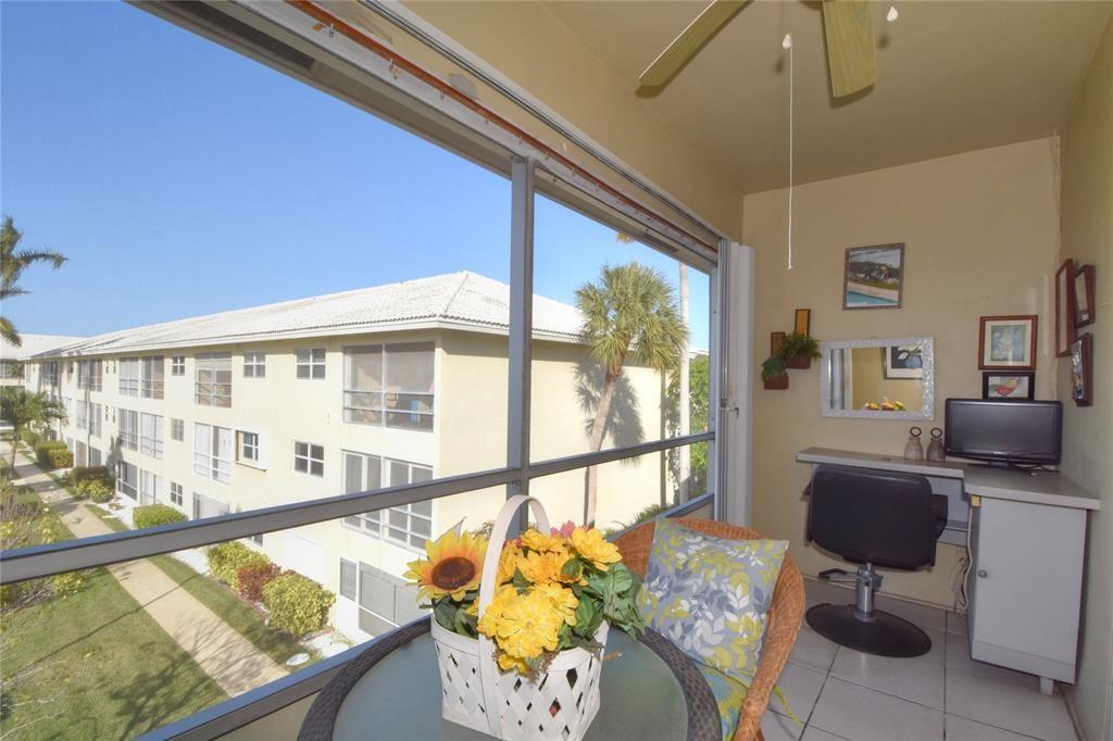 1951 Northeast 39th Street, Unit 360 Lighthouse Point, FL 33064 - Photo 18 of 28 a view of an outdoor dining room with furniture