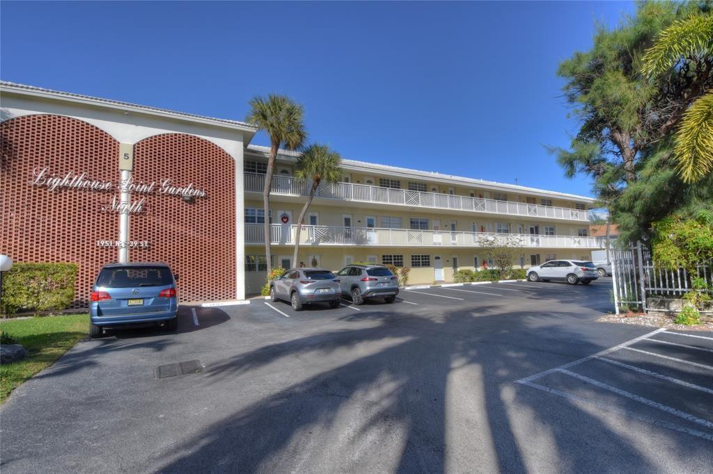 1951 Northeast 39th Street, Unit 360 Lighthouse Point, FL 33064 - Photo 2 of 28 a view of a building with street view
