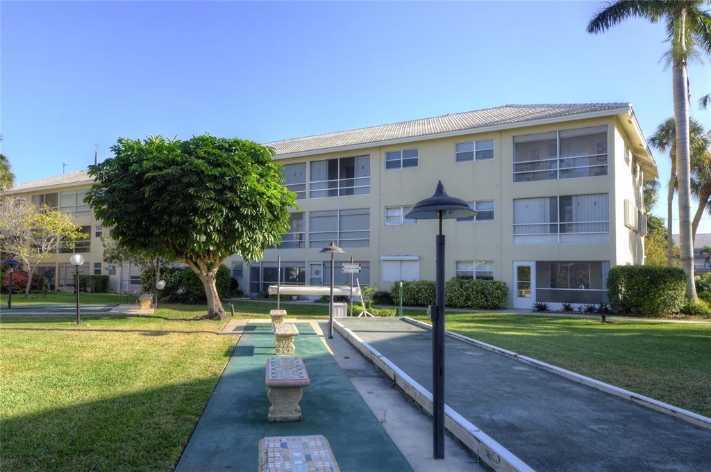 1951 Northeast 39th Street, Unit 360 Lighthouse Point, FL 33064 - Photo 26 of 28 a view of a house with a swimming pool