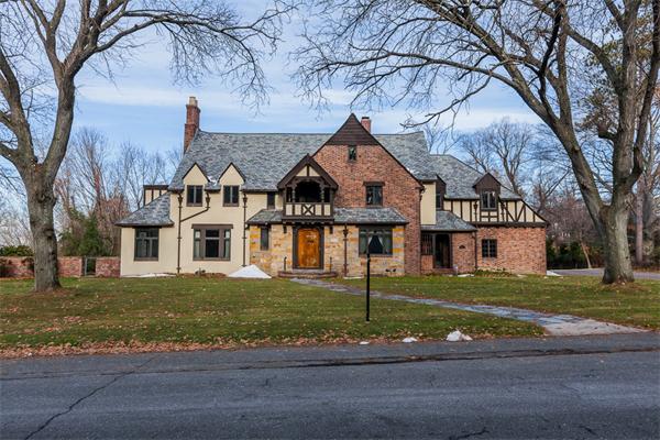 368 Longhill Street Springfield, MA 01108 - Photo 1 of 30 a view of a white house next to a yard with big trees