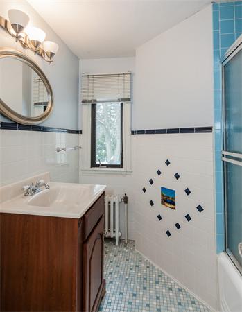 368 Longhill Street Springfield, MA 01108 - Photo 25 of 30 a bathroom with a sink mirror and a bathtub