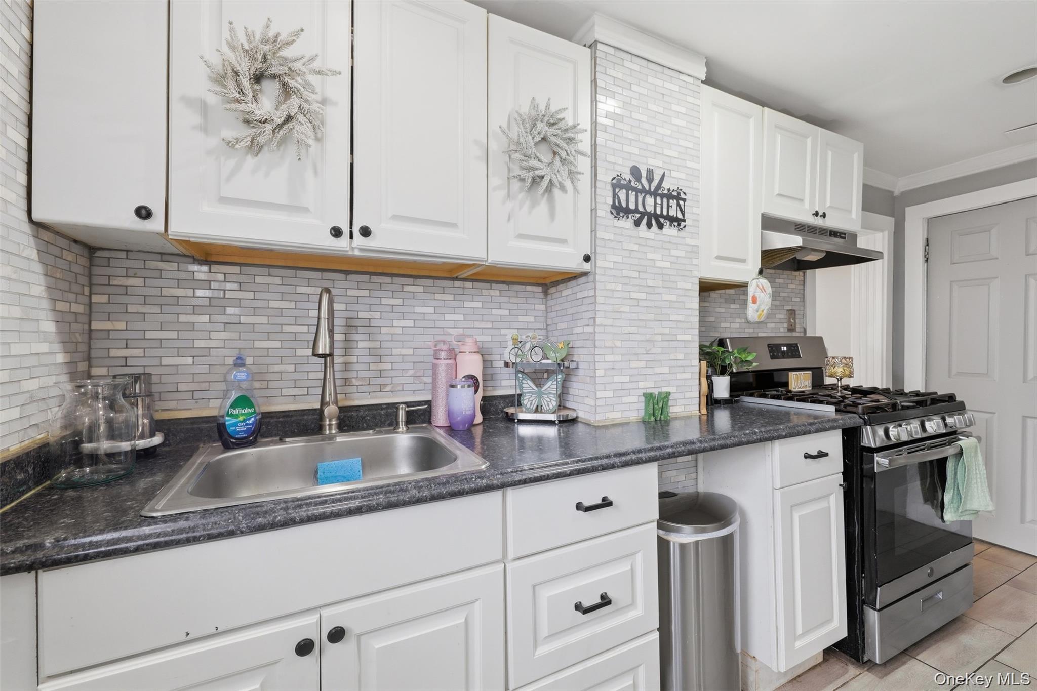 121 Little Britain Road Newburgh, NY 12550 - Photo 6 of 15 a kitchen with stainless steel appliances granite countertop a sink a stove and cabinets