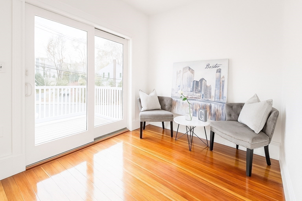 145 Lagrange Street Boston, MA 02132 - Photo 18 of 37 a living room with furniture and a wooden floor