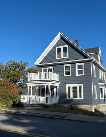 a front view of a house with yard