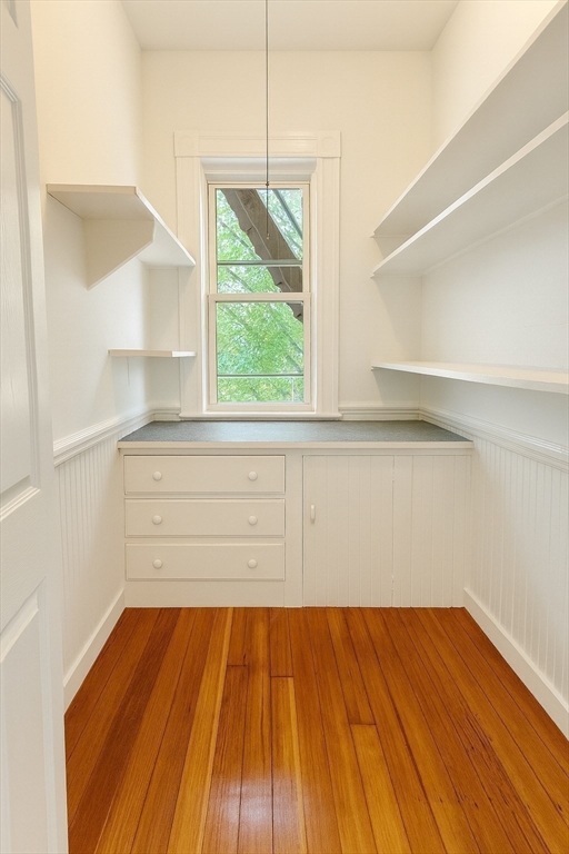 145 Lagrange Street Boston, MA 02132 - Photo 4 of 37 a view of a room that has wooden floor and a window