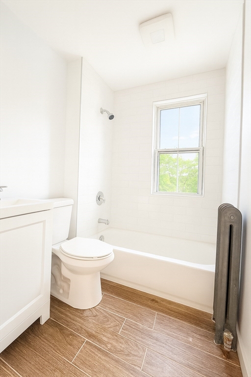 145 Lagrange Street Boston, MA 02132 - Photo 5 of 37 a bathroom with a toilet a sink and a bathtub