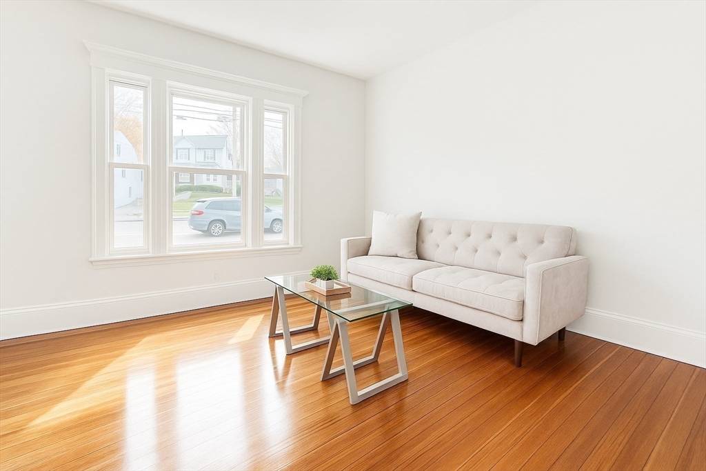145 Lagrange Street Boston, MA 02132 - Photo 6 of 37 a living room with furniture and a wooden floor