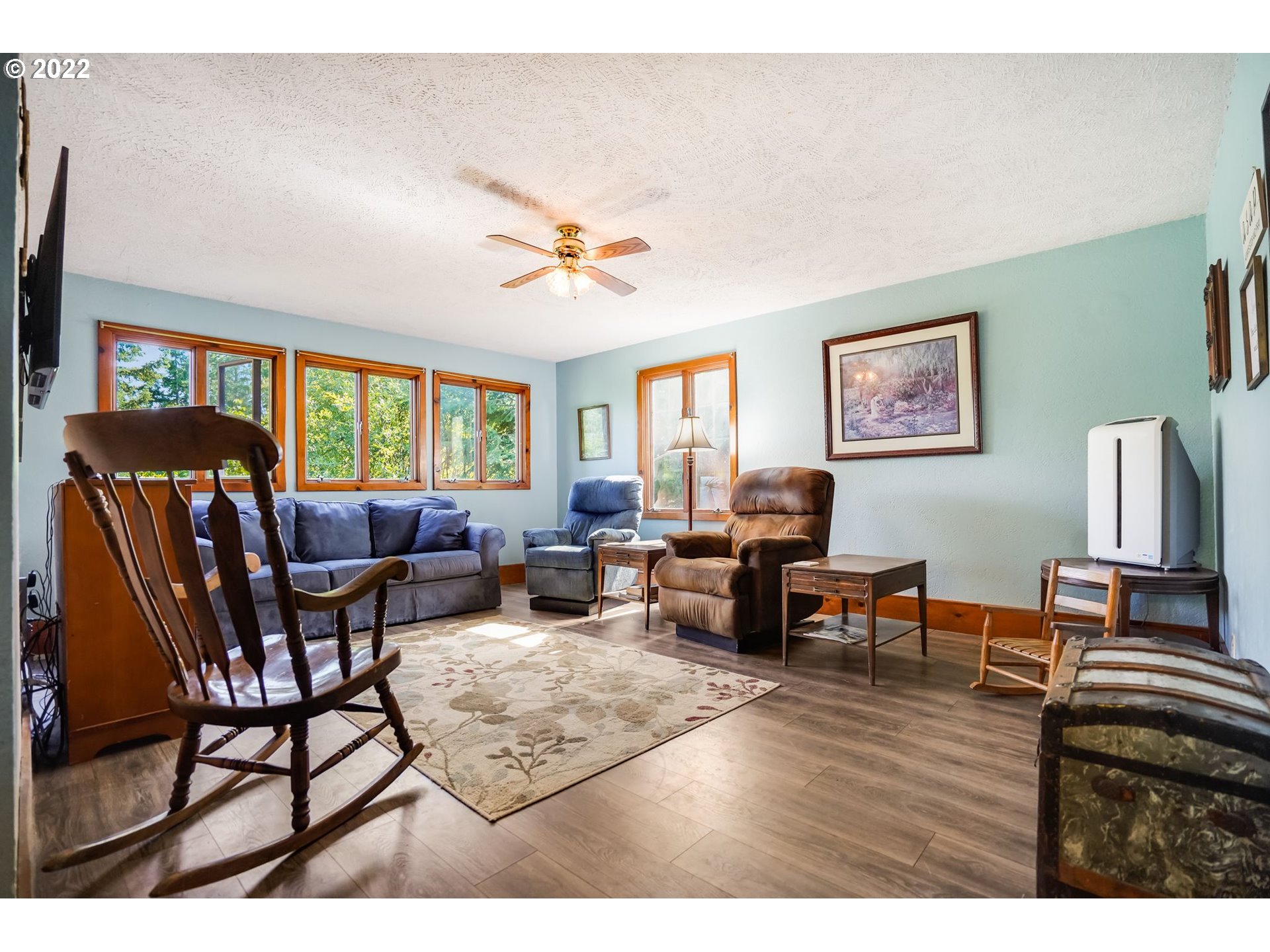 277 Trout Lake Creek Road Trout Lake, WA 98650 - Photo 23 of 35 a living room with furniture wooden floor and a window