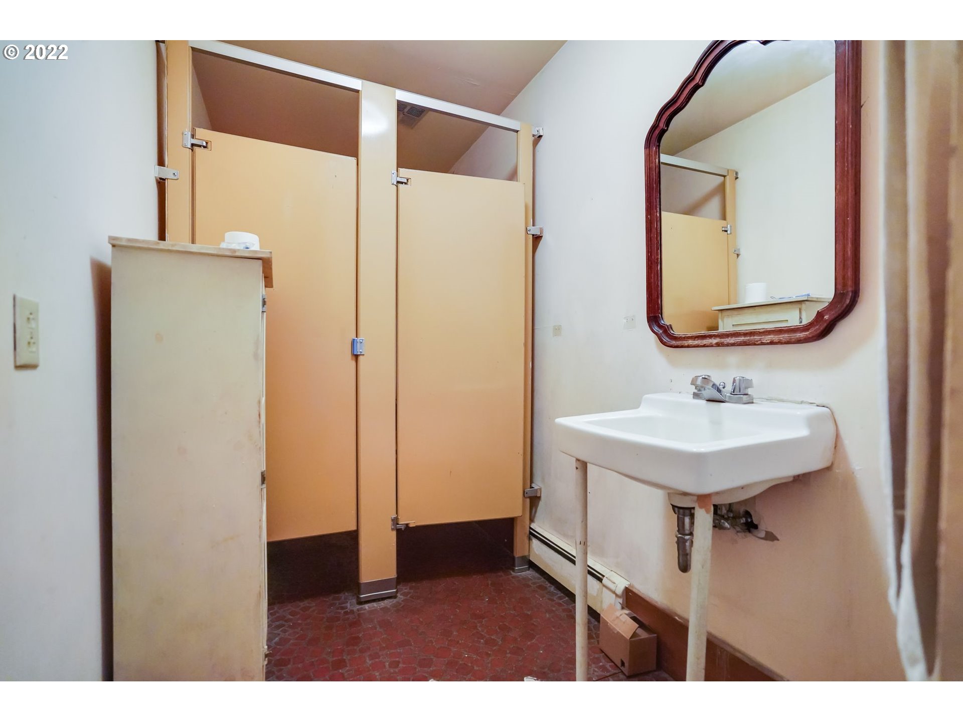 277 Trout Lake Creek Road Trout Lake, WA 98650 - Photo 26 of 35 a bathroom with a sink a mirror and a shower