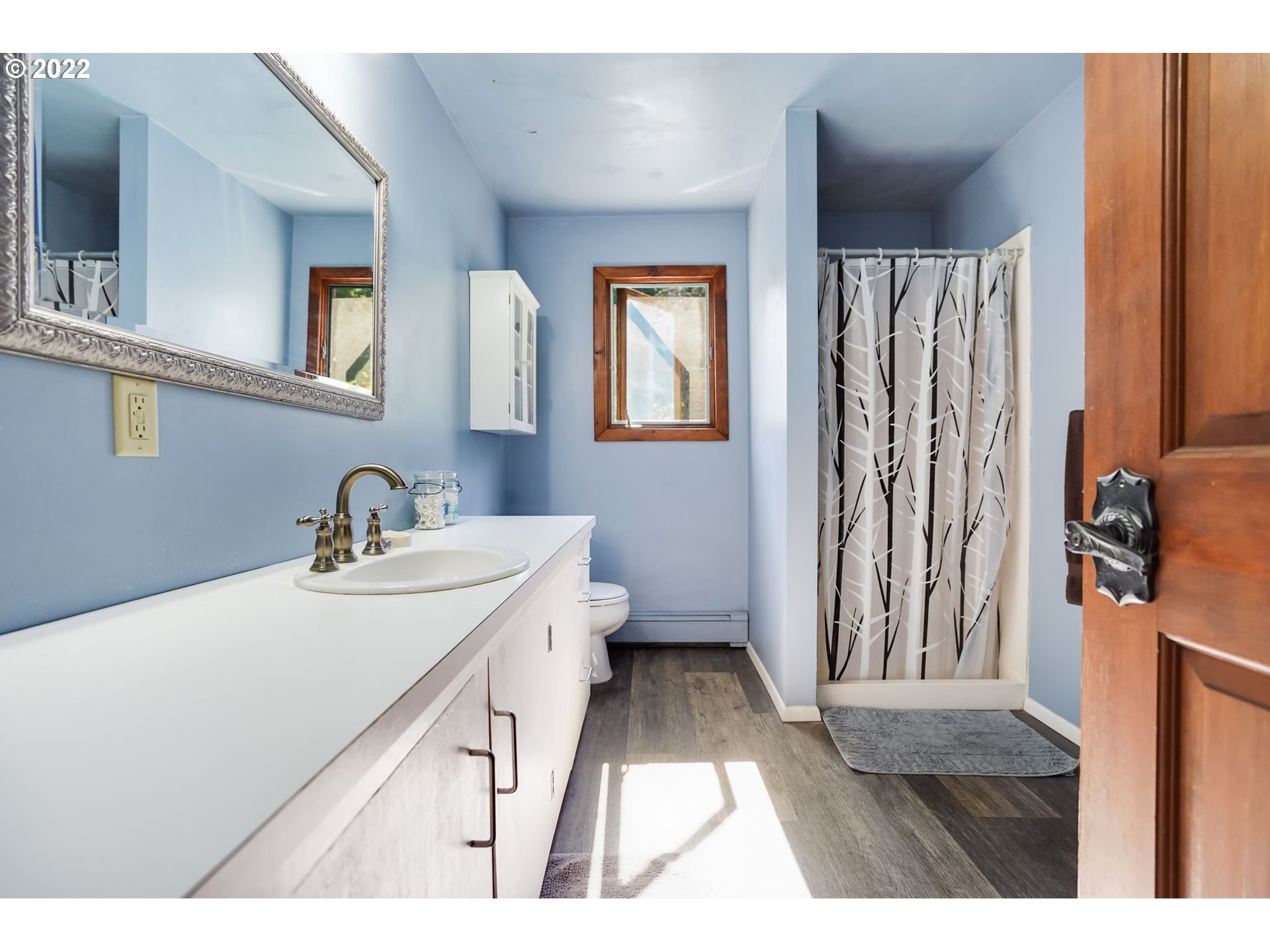 277 Trout Lake Creek Road Trout Lake, WA 98650 - Photo 32 of 35 a bathroom with a sink a toilet and a mirror