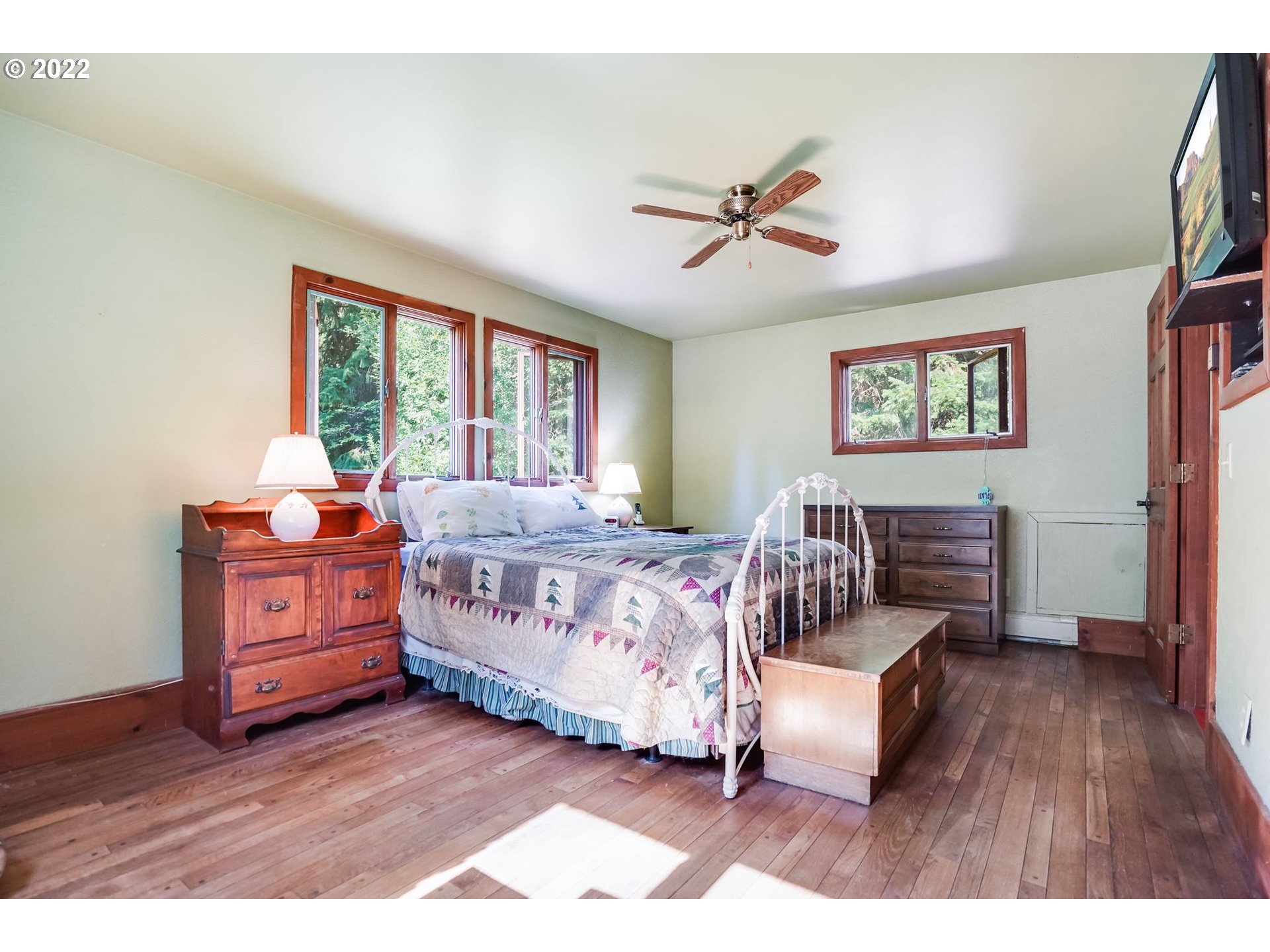 277 Trout Lake Creek Road Trout Lake, WA 98650 - Photo 34 of 35 a bedroom with a bed and wooden floor