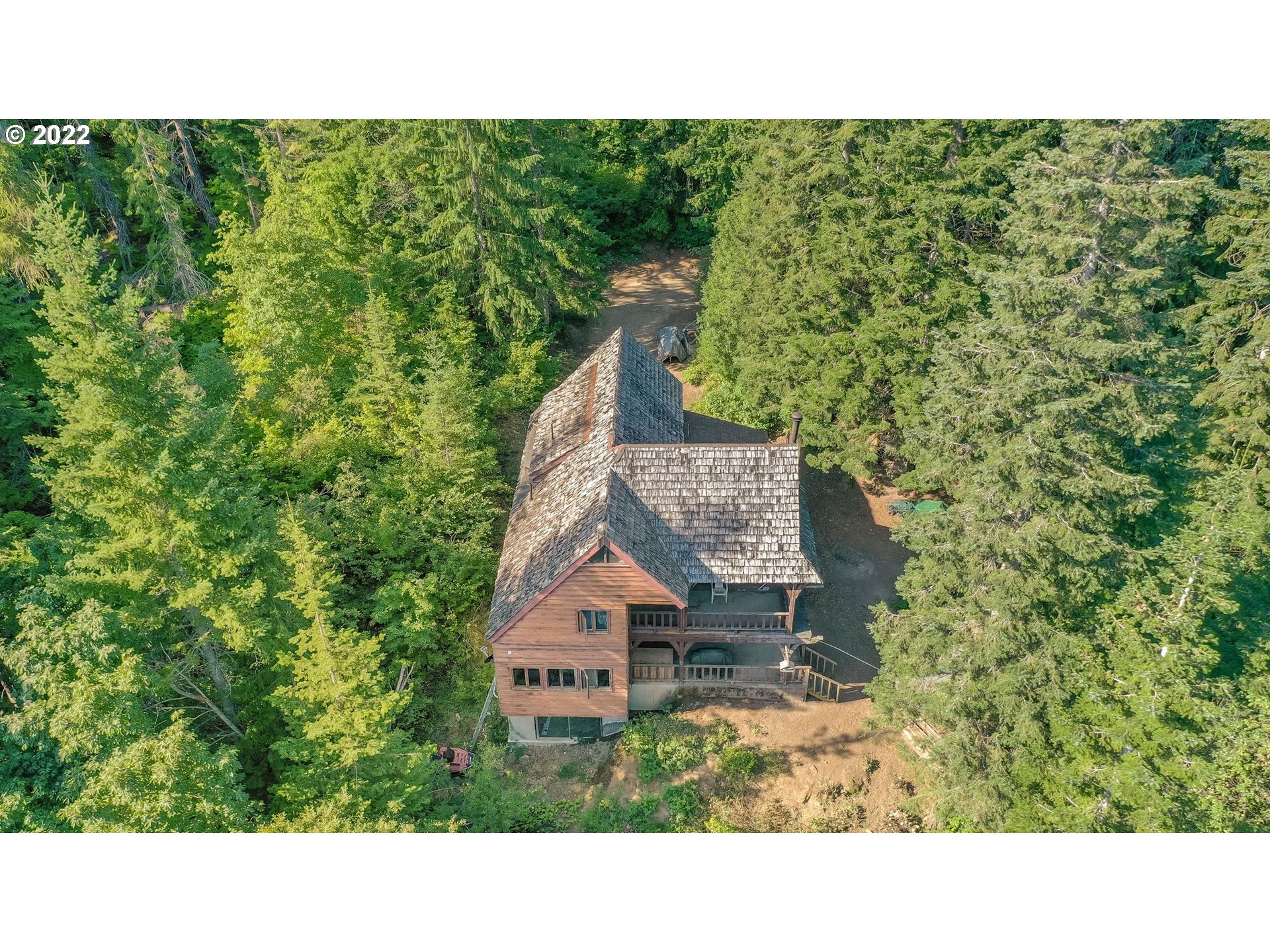 277 Trout Lake Creek Road Trout Lake, WA 98650 - Photo 7 of 35 a picture of a bench in a garden