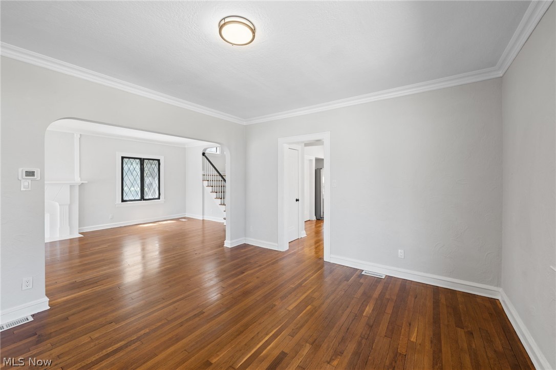 4548 Turney Road Cleveland, OH 44105 - Photo 7 of 35 Dining room featuring ornamental molding and dark hardwood / wood-style flooring