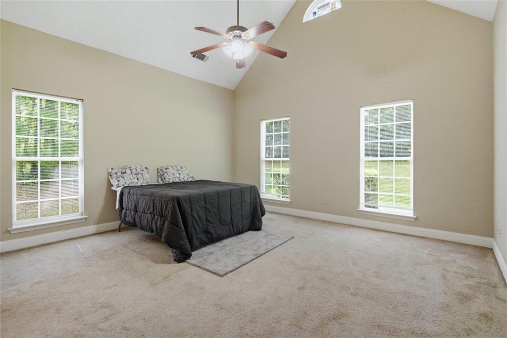 1231 Hillview Road Hampton, GA 30228 - Photo 18 of 49 a bedroom with a bed and window
