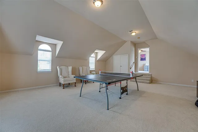 a view of a room with chairs and a window